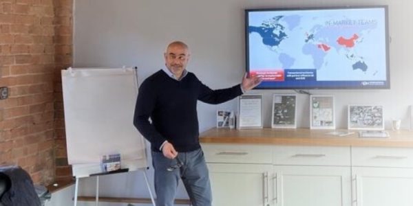 ADN Partnership team presenting global business strategy in a modern office setting