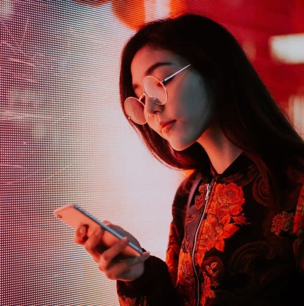 A Chinese girl checking her mobile phone
