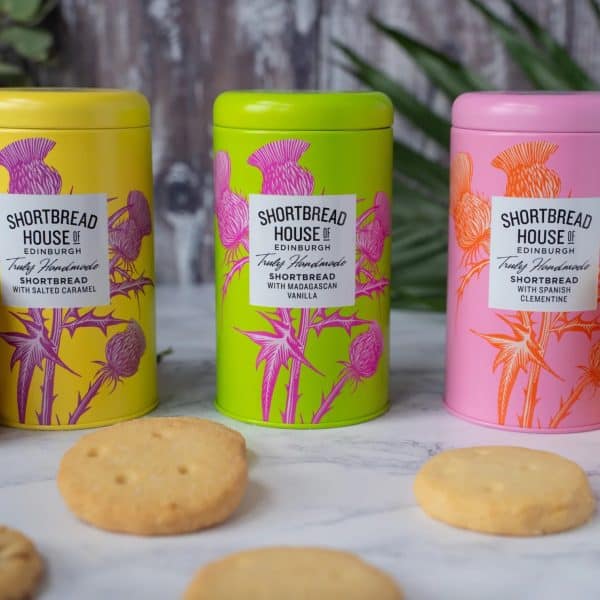 Shortbread House of Edinburgh tins with colourful floral designs and cookies in front